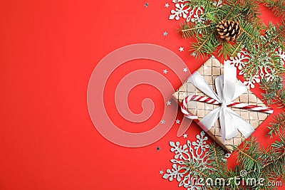 Christmas composition with gift box and festive decor on color background Stock Photo