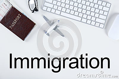 Flat lay composition with airplane model and computer keyboard on background. Immigration concept Stock Photo