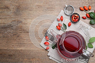 Flat lay composition with aromatic rose hip tea on wooden table. Space for text Stock Photo