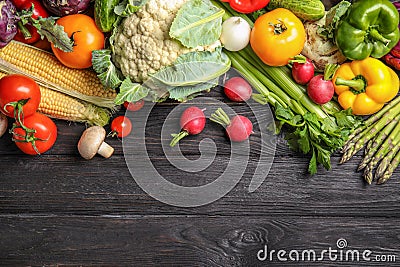 Flat lay composition with assortment of fresh vegetables on wooden table Stock Photo