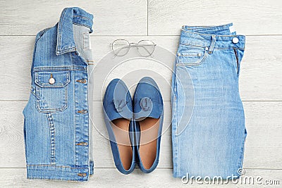 Flat lay composition with blue jeans, jacket and shoes Stock Photo
