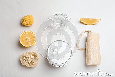 Flat lay composition with bowl of baking soda, lemon and cleaning items Stock Photo