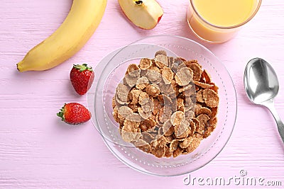 Flat lay composition with cornflakes on pink table. Healthy breakfast Stock Photo