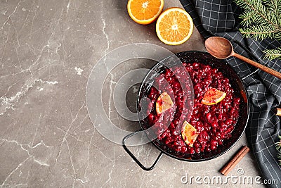 Flat lay composition with cranberry sauce in pan on table Stock Photo