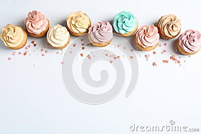 Flat lay composition with delicious birthday cupcakes Stock Photo