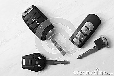 Flat lay composition with different car keys on light background Stock Photo