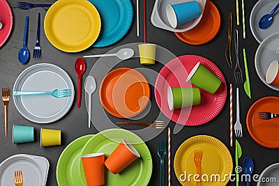 Flat lay composition with different disposable tableware on black background Stock Photo