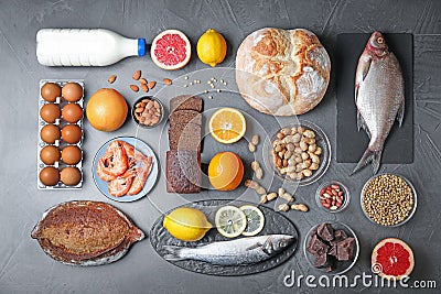 Flat lay composition with different on dark grey background. Food allergy concept Stock Photo