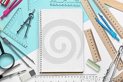 Flat lay composition with different rulers and notebook on color background Stock Photo