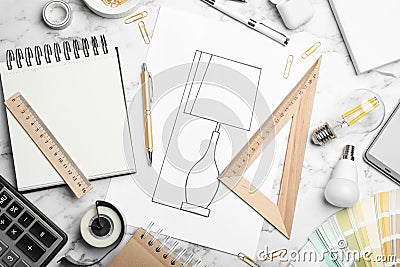 Flat lay composition with drawing of lamp on marble table. Designer`s workplace Stock Photo