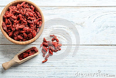 Flat lay composition with dried goji berries on white table, space for text. Healthy superfood Stock Photo