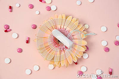 Flat lay composition with flower, pills and tampon Stock Photo