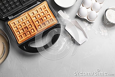 Flat lay composition with fresh Belgian waffles on light grey table Stock Photo