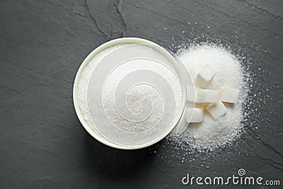 Flat lay composition with granulated sugar on dark table Stock Photo
