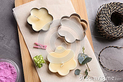 Flat lay composition of handmade candles with cutters Stock Photo