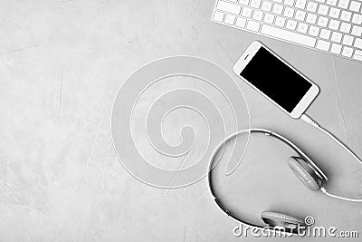 Flat lay composition with headphones, smartphone, computer keyboard and space for text Stock Photo