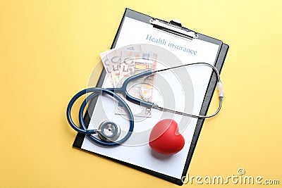 Flat lay composition with medical insurance form, money, heart and stethoscope Stock Photo