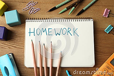 Flat lay composition of notebook with word HOMEWORK on table Stock Photo