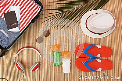 Flat lay composition with open suitcase and beach items Stock Photo