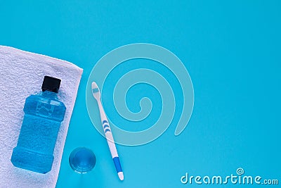 Flat lay composition with oral care products and copy space for text on blue background Stock Photo