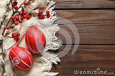 Flat lay composition with painted red Easter eggs on wooden table Stock Photo