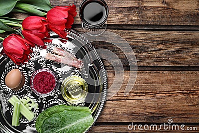 Flat lay composition with Passover Seder plate keara on wooden table. Pesah celebration Stock Photo