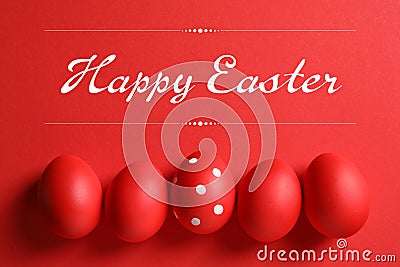 Flat lay composition of red painted eggs and text Happy Easter Stock Photo
