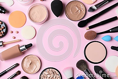Flat lay composition with skin foundation, powder and beauty accessories on color background Stock Photo