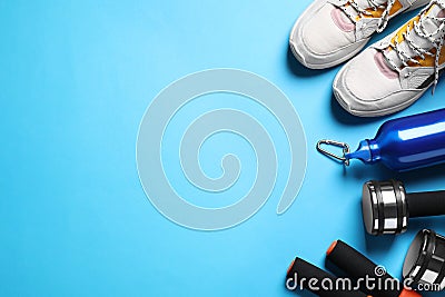 Flat lay composition with sport items on blue background. Space for text Stock Photo