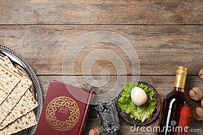 Flat lay composition with symbolic Passover Pesach items on wooden background Stock Photo