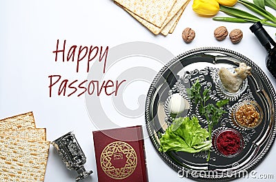 Flat lay composition of symbolic Pesach items on white. Happy Passover Stock Photo