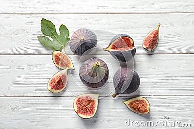 Flat lay composition with whole and cut purple figs Stock Photo