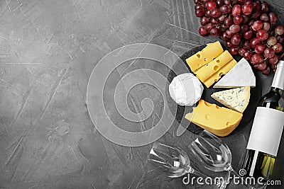 Flat lay composition with wine, snacks on grey background Stock Photo