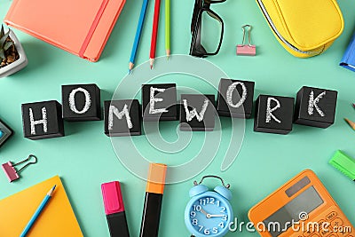 Flat lay composition with word HOMEWORK made of black cubes on background Stock Photo