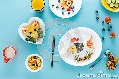 Flat lay with creatively styled children`s breakfast with juice Stock Photo