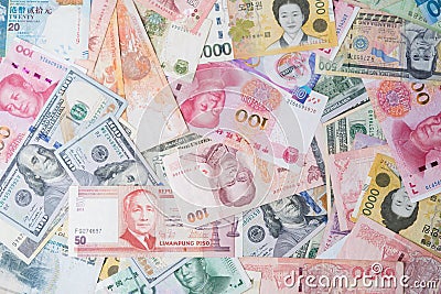 Flat lay design of various international banknote include Dollar Yuan Baht Won for currency exchange and forex trading concept Stock Photo