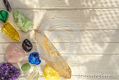 Different minerals and crystals on the white wooden background Stock Photo