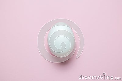 Flat lay of Easter egg on plain pink background Stock Photo