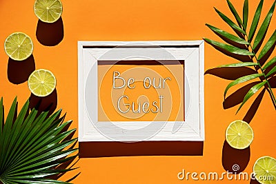 Orange Flat Lay, Picture Frame, Lemon, Text Be Our Guest Stock Photo