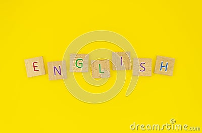 Flat lay English word made from wooden blocks with letters, learn how to speak English concept Stock Photo