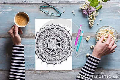 Flat lay, female coloring adult coloring book Stock Photo
