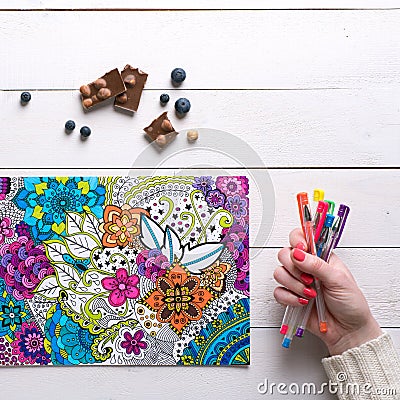 Flat lay, female coloring adult coloring book Stock Photo