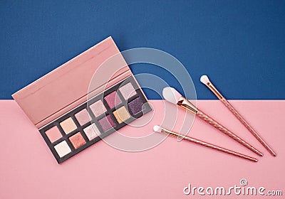 Flat lay female cosmetics collage with eye shadows and brushes o Stock Photo