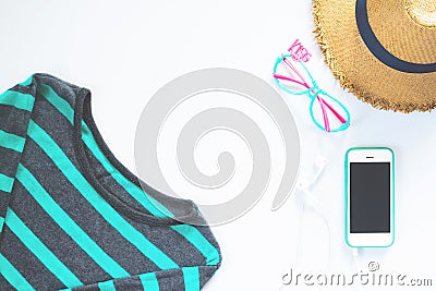 Flat lay feminine clothes and accessories collage with t-shirt, hat with mobile phone and earphone on white backg Stock Photo