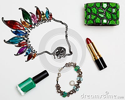 Flat lay feminini accessories collage with glasses, lipstick, bracelet, necklace on white background. Stock Photo