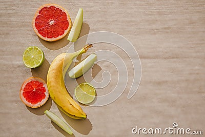 Tropical fruit flat lay on a light background. Stock Photo