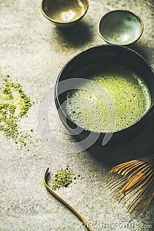 Flat-lay of freshly brewed Japanese matcha green tea in bowl Stock Photo