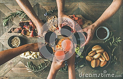 Flat-lay of friends eating and drinking together, top view Stock Photo