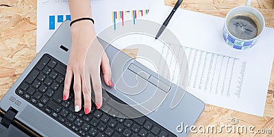 Flat lay home office desk. Women workspace with female hands Stock Photo