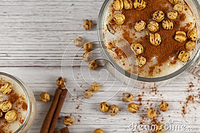 Flat lay image of two glass cups of traditional Turkish Boza, a sweet and sour fermented drink Stock Photo